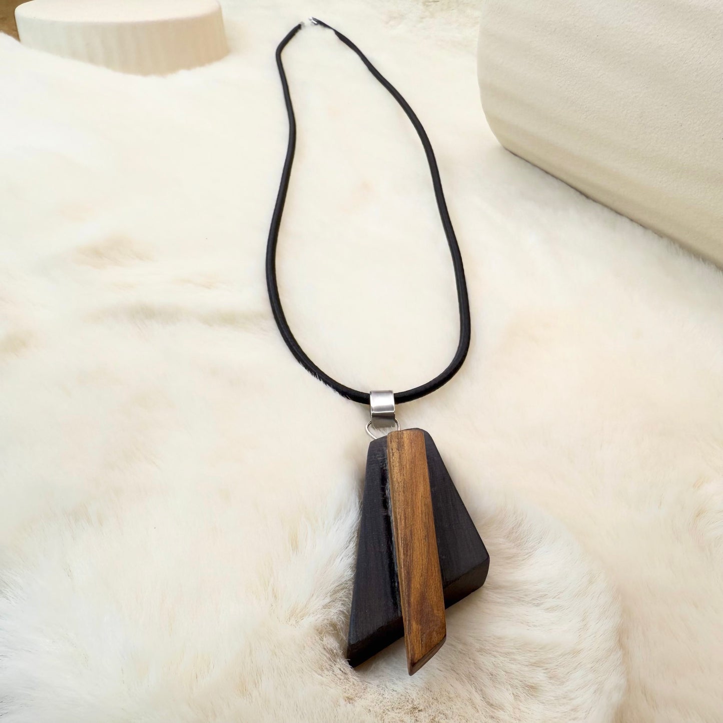 Artisan jewelry piece made from 3000-year-old bog oak and pine