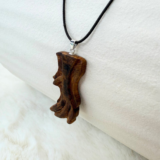 Wooden pendant on a black cord