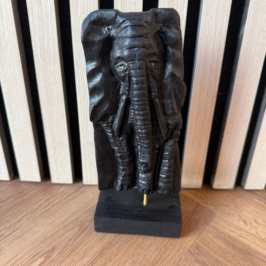 Hand-carved elephant sculpture made from ancient Irish bog oak, front view