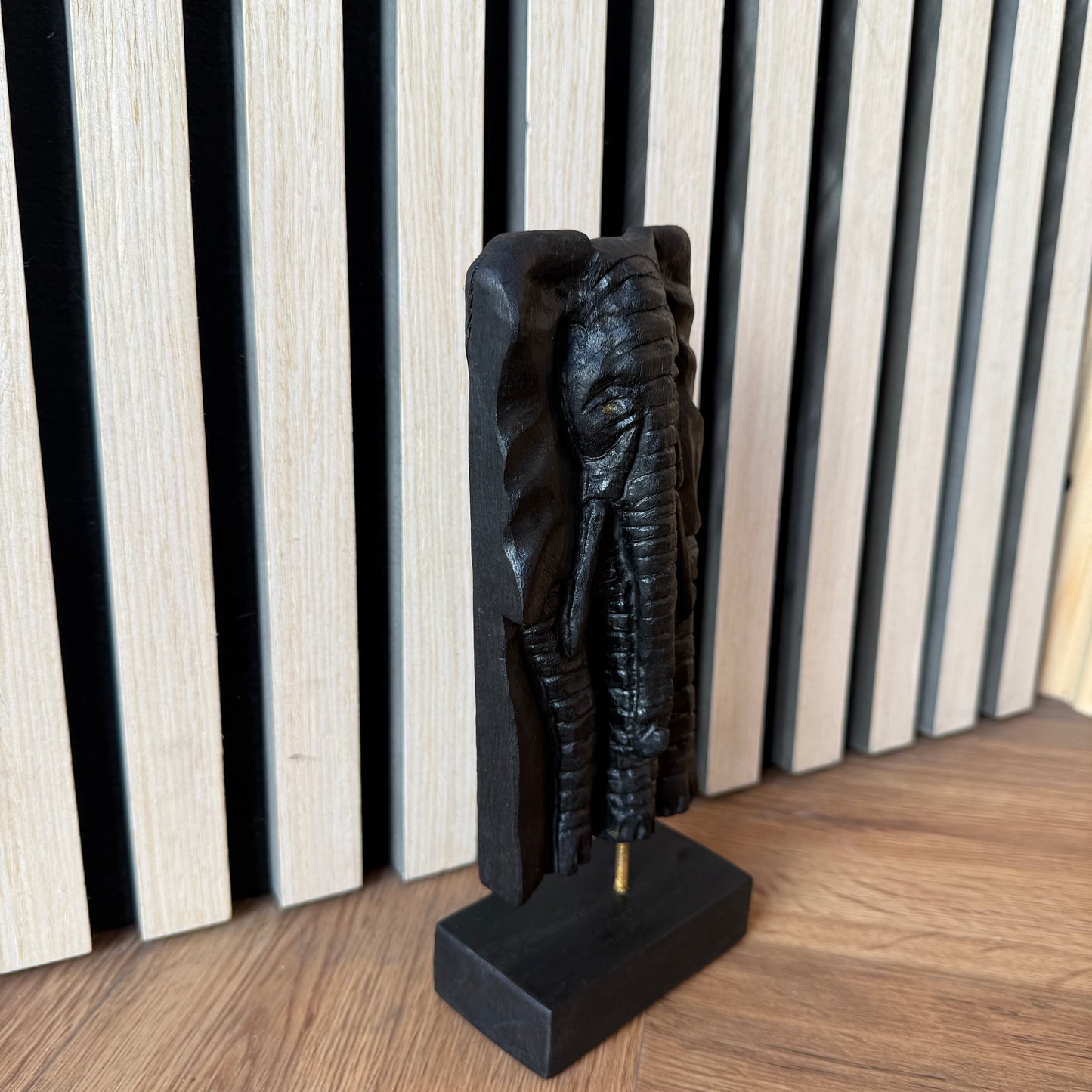 Side angle of luxury elephant sculpture in rare bog oak wood