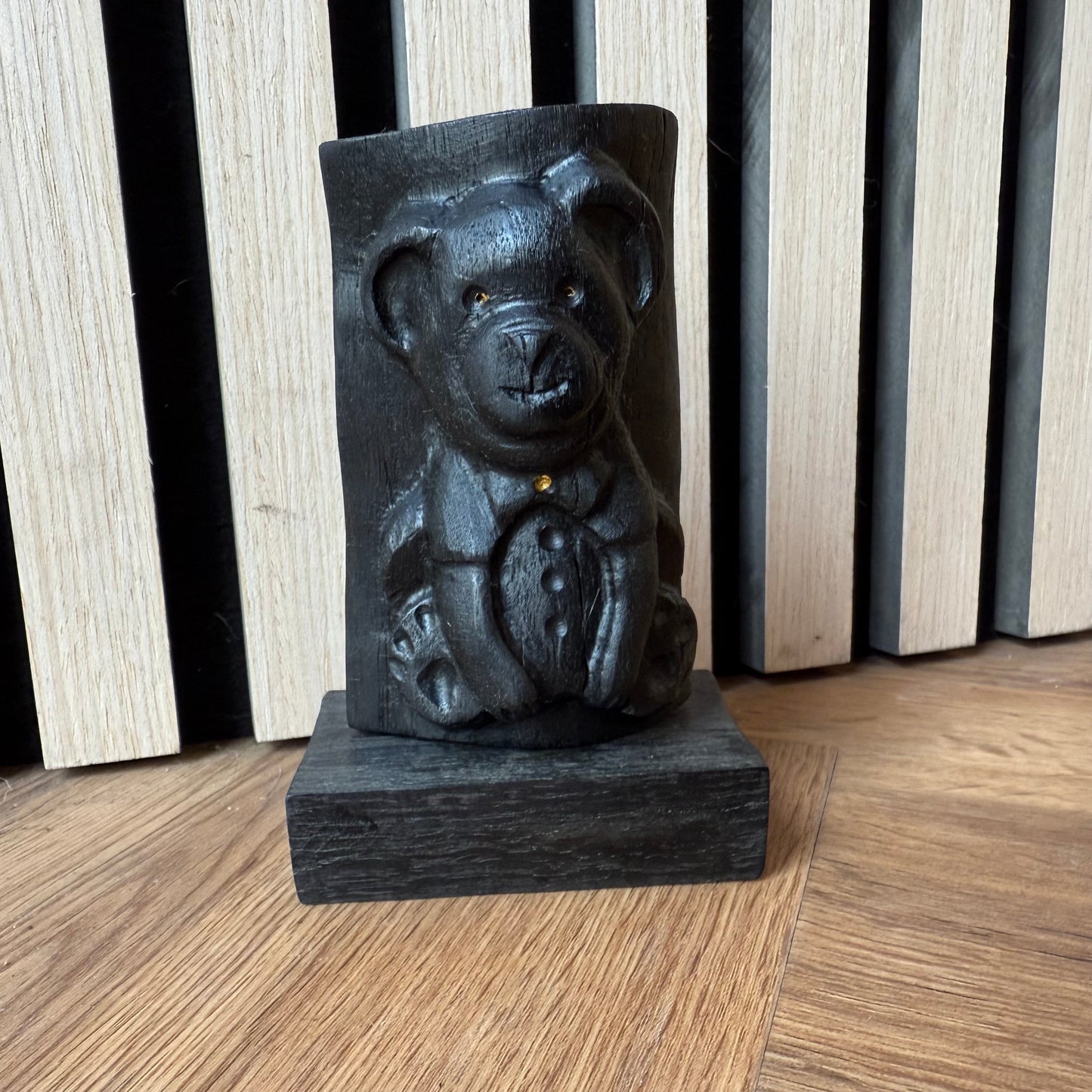 Artisan-crafted bear statue with natural black oak finish
