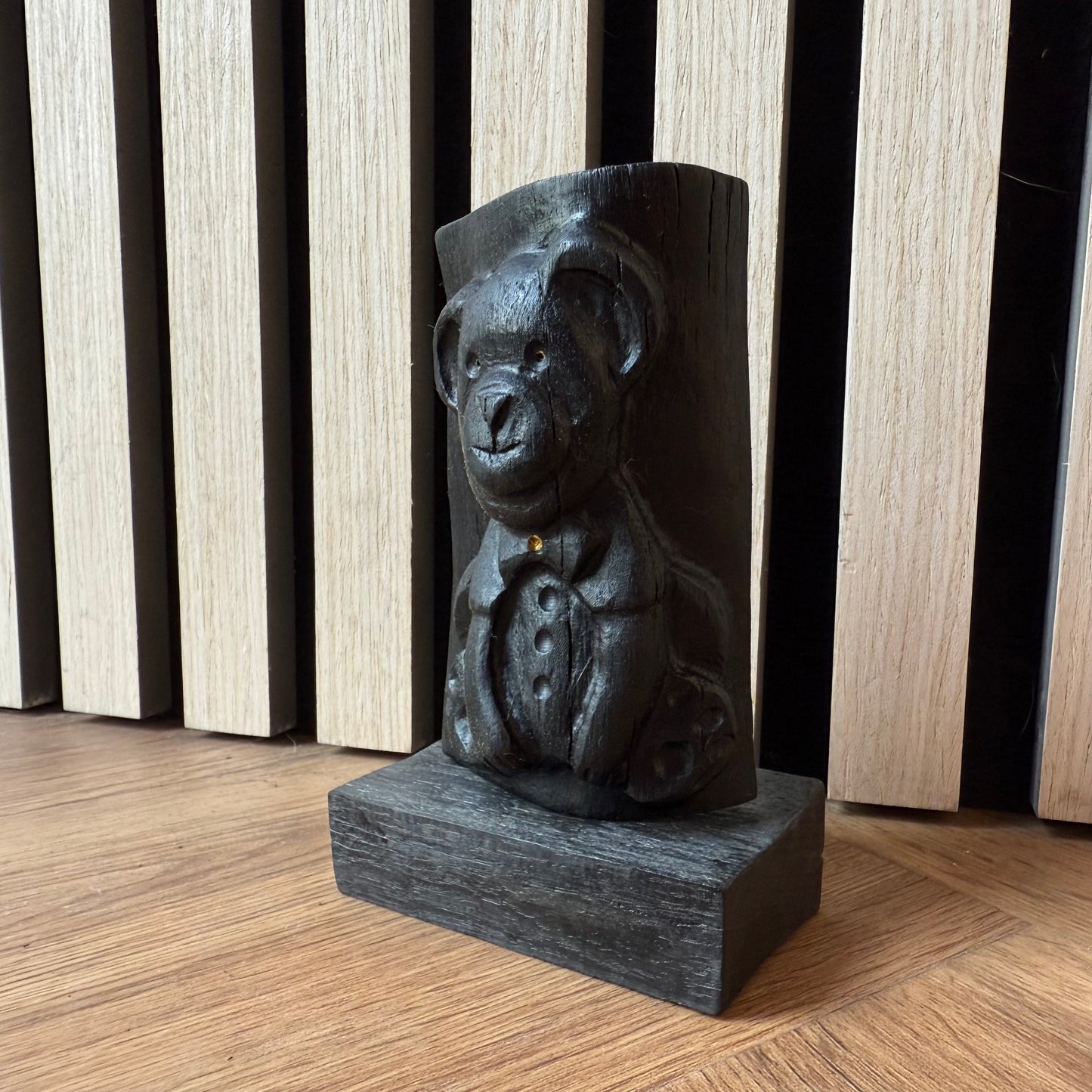 Artisan-crafted bear statue with natural black oak finish
