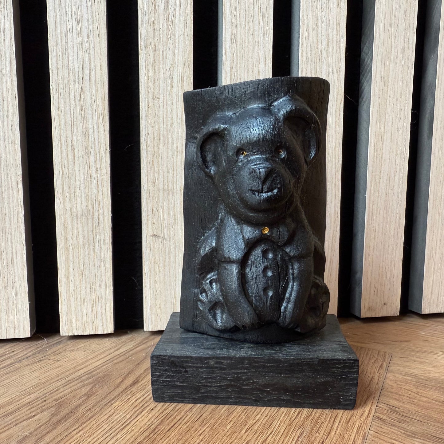 Detailed shot of carved wooden bear paw and body texture