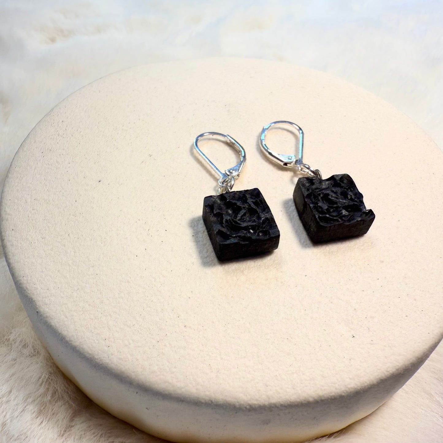 Sterling silver leverback hooks attached to dark bog oak earrings