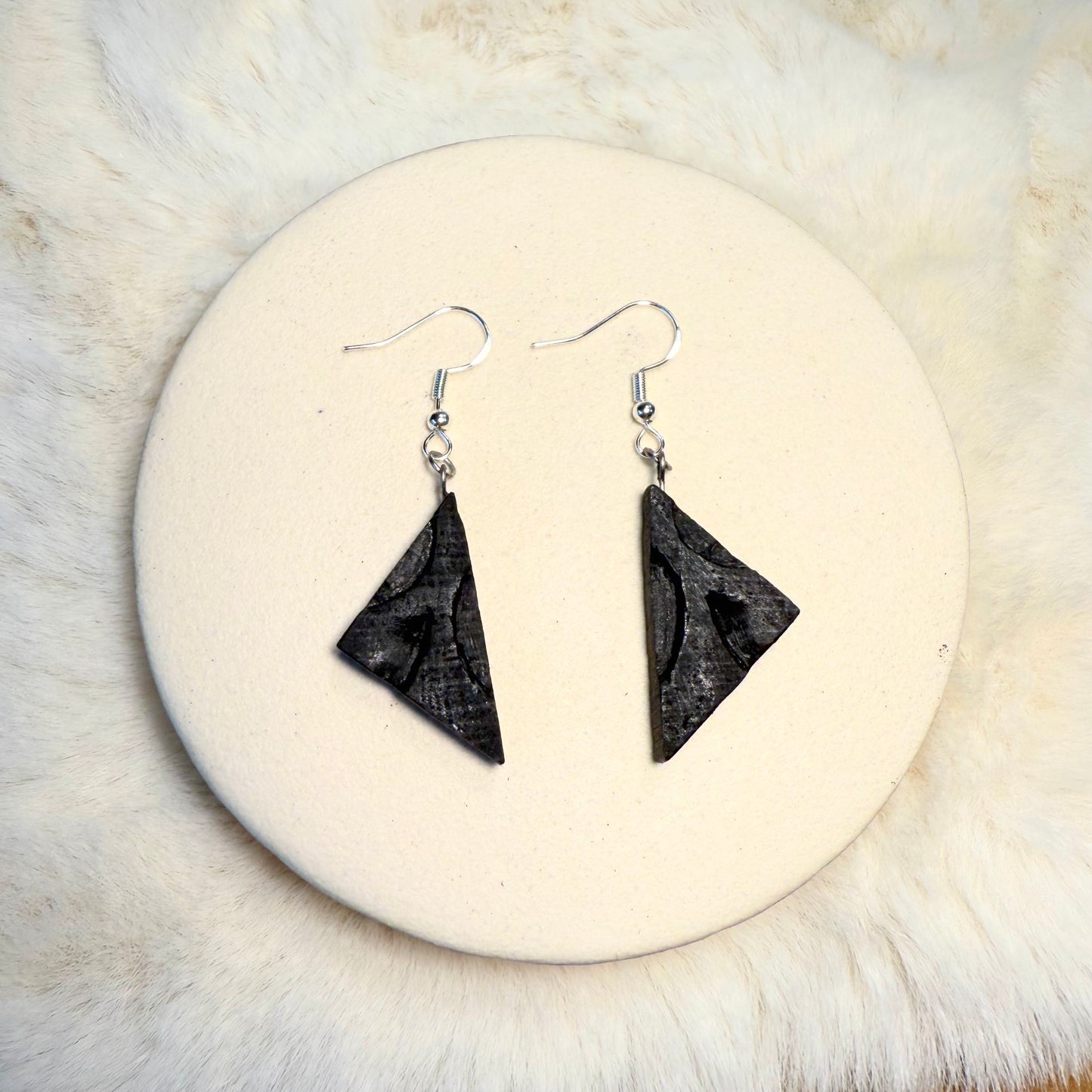 One-of-a-kind bog oak earrings with visible wood grain texture.