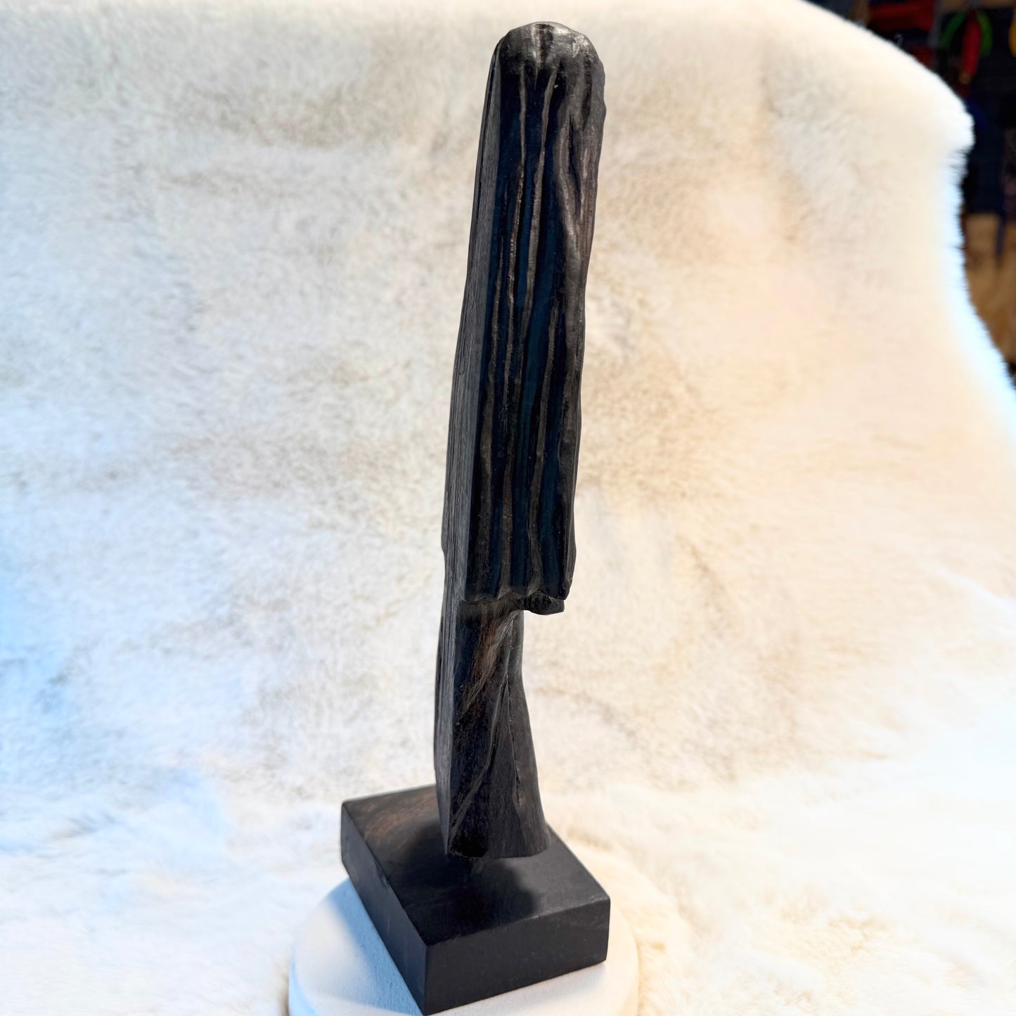 Small figurine carved from thousand-year-old bog oak wood