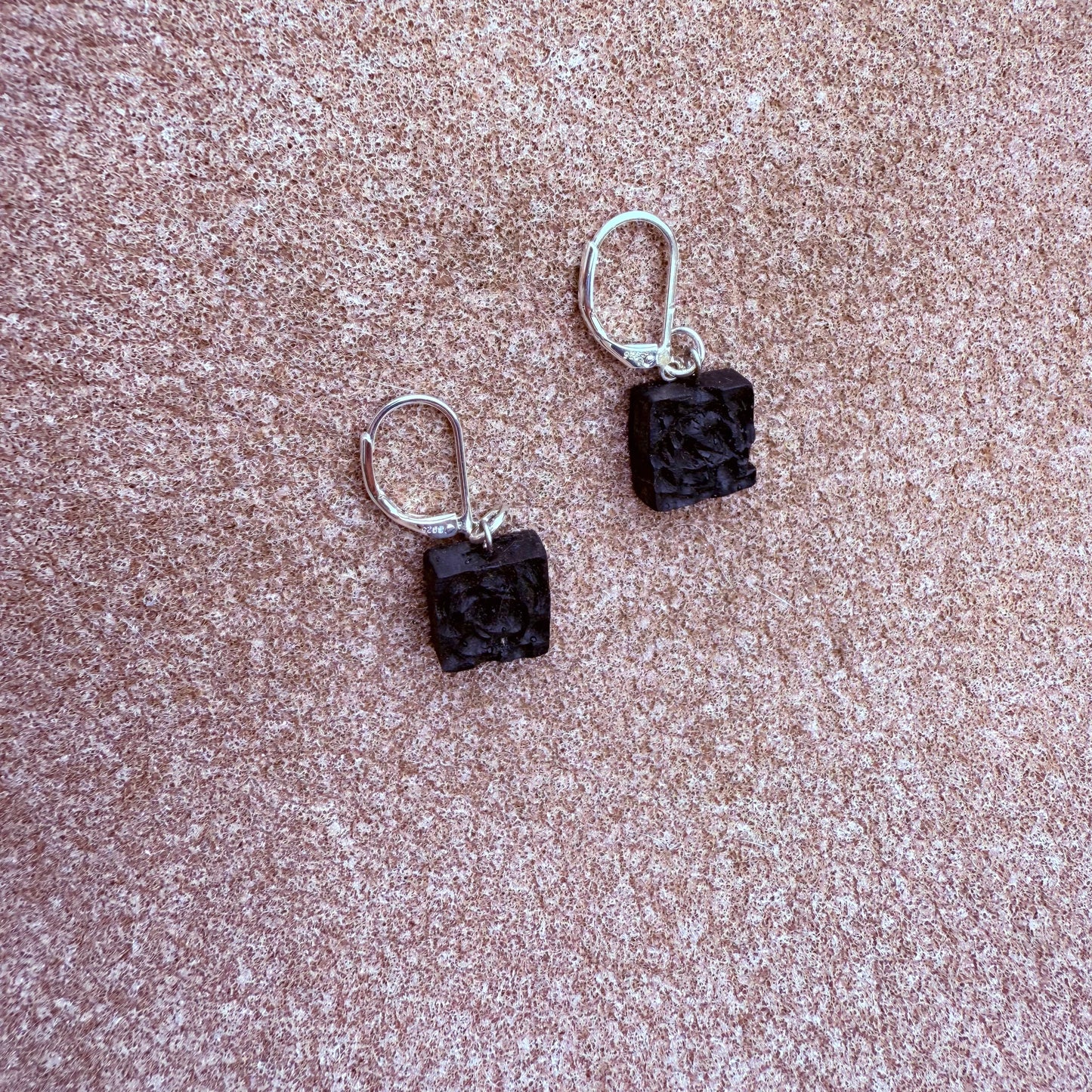 Lightweight Irish bog oak earrings displayed flat on wood surface