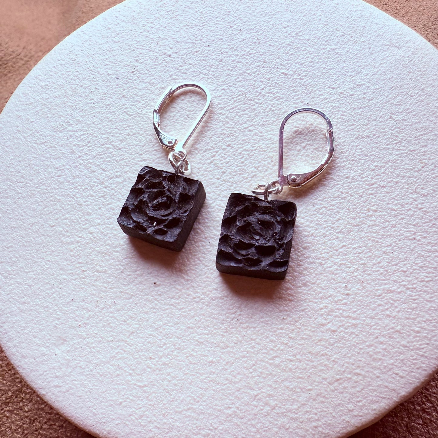 Pair of bog oak earrings with floral carving, artisan jewelry