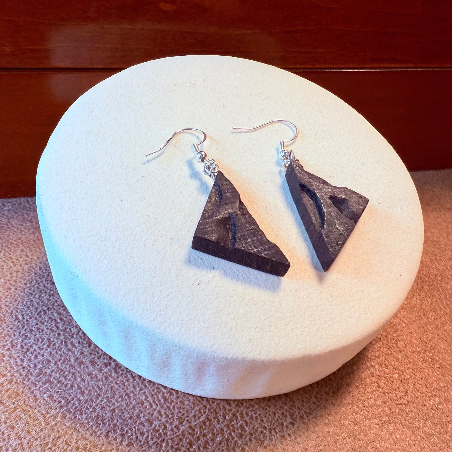 Bog oak earrings shown on model for scale and fit.