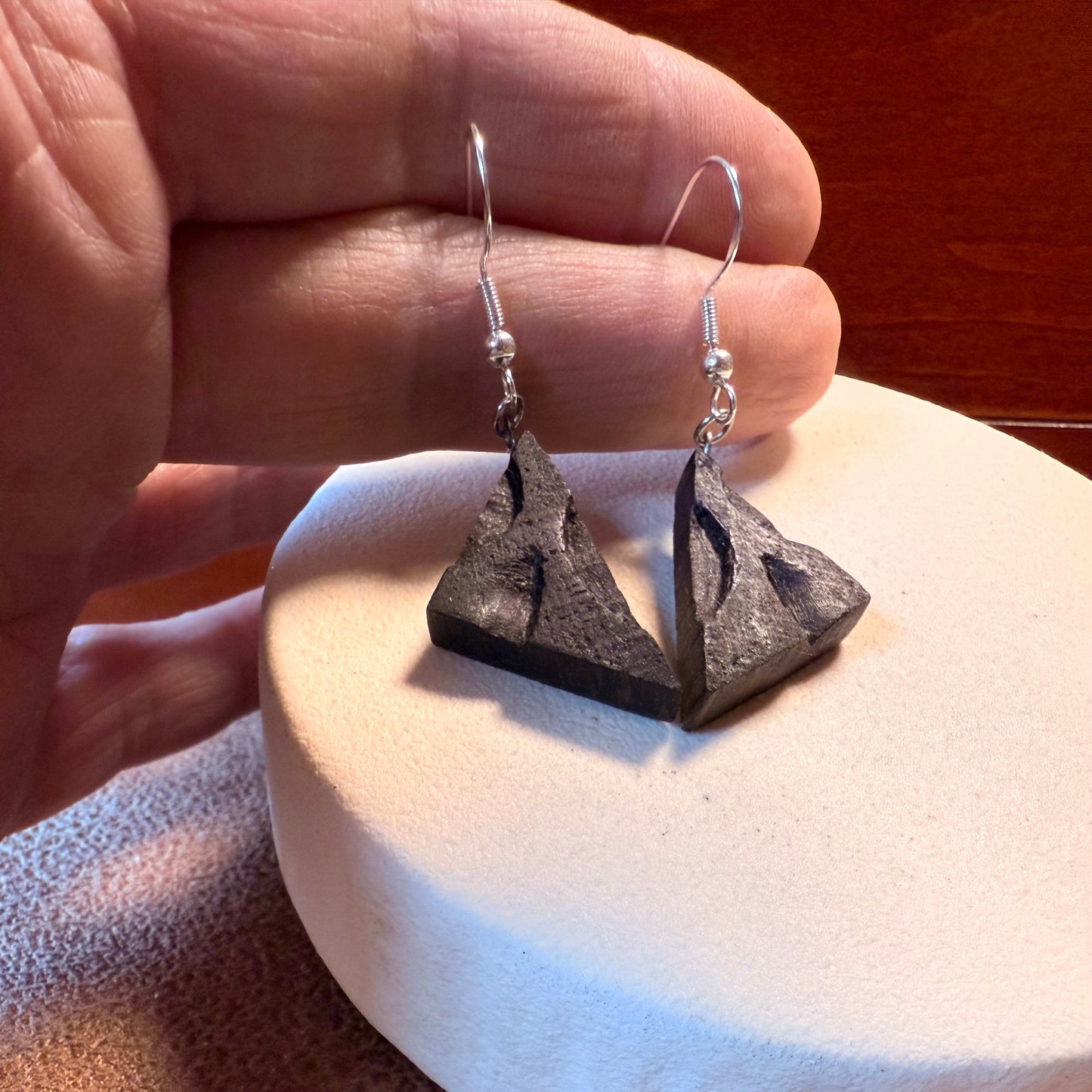 Handmade wooden earrings styled with casual outfit.