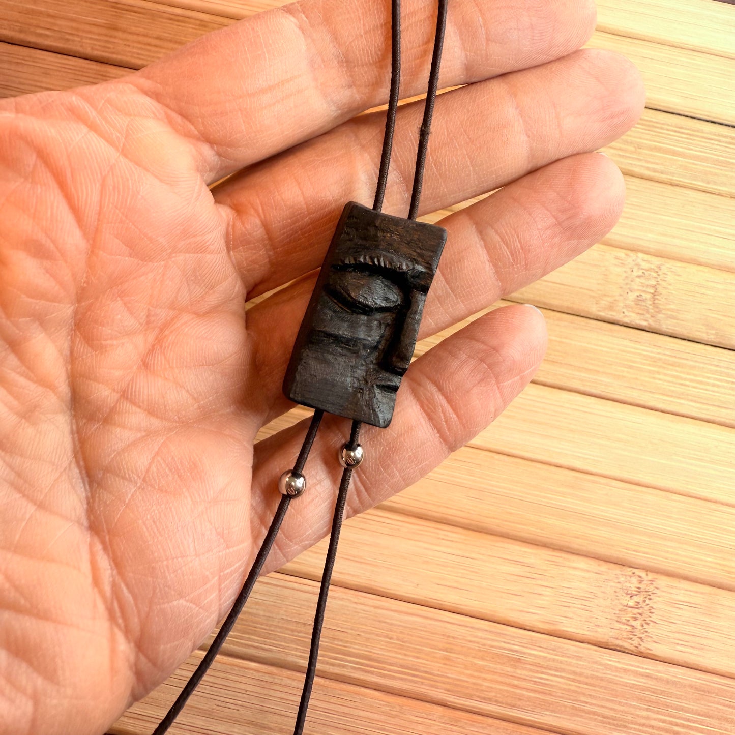 Adjustable necklace with historic bog oak wood pendant and symbolic face carving