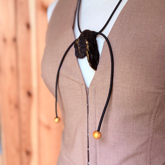 Handmade natural wood necklace featuring dark oak and gold details