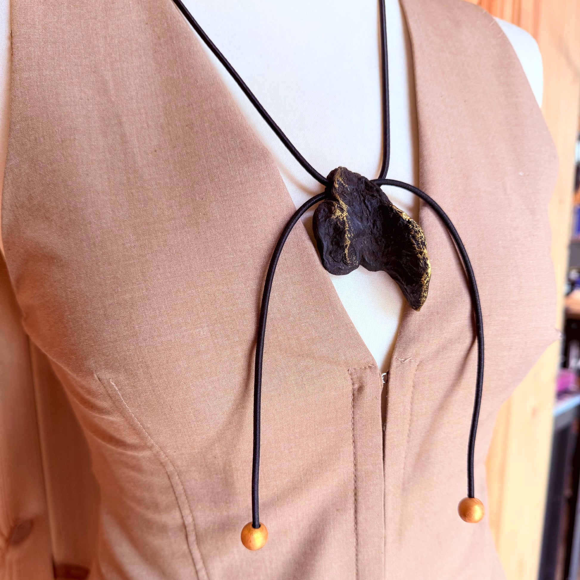 Adjustable bog oak pendant necklace with gold wooden beads on elastic cord