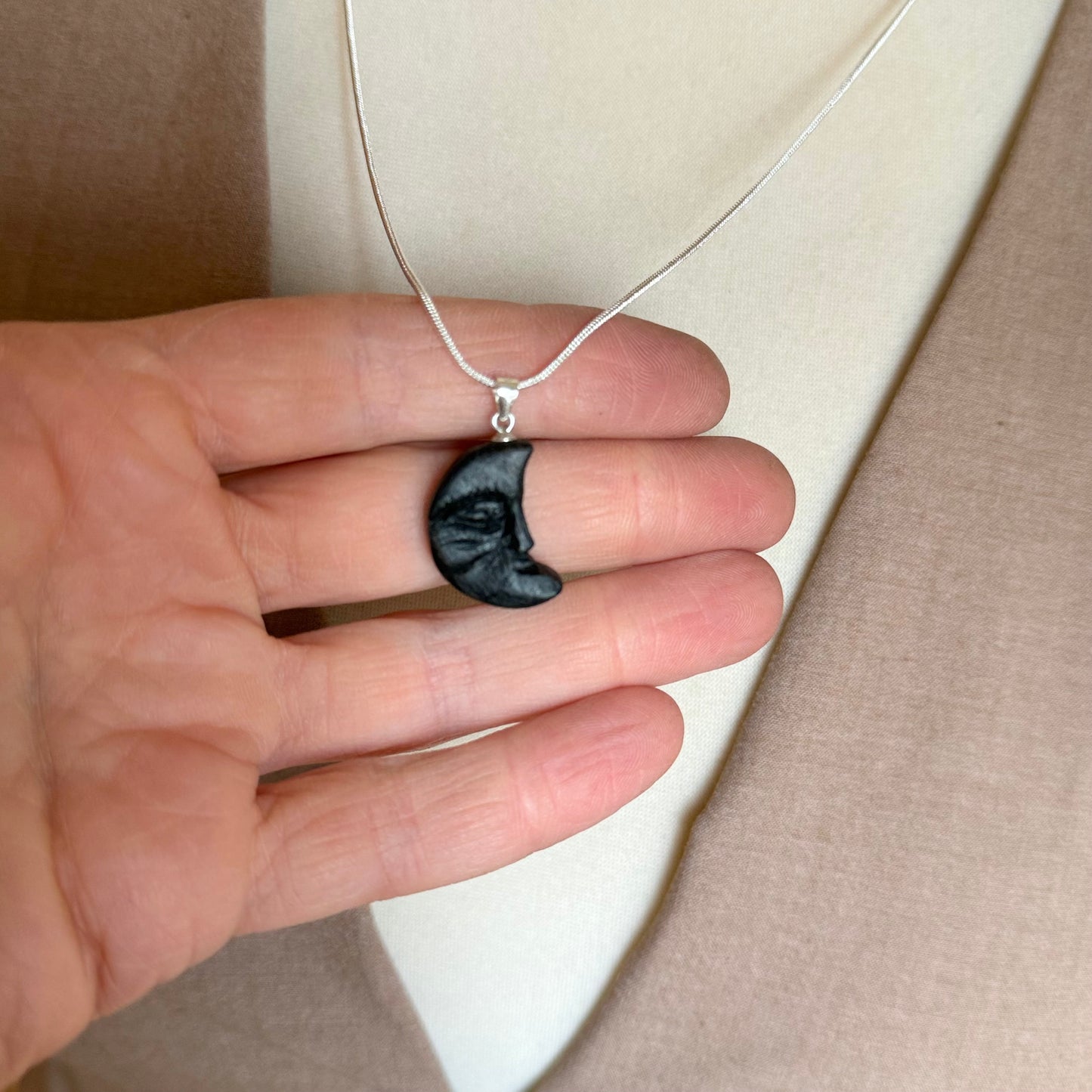 Hand-carved crescent moon pendant made from bog oak on silver-plated chain