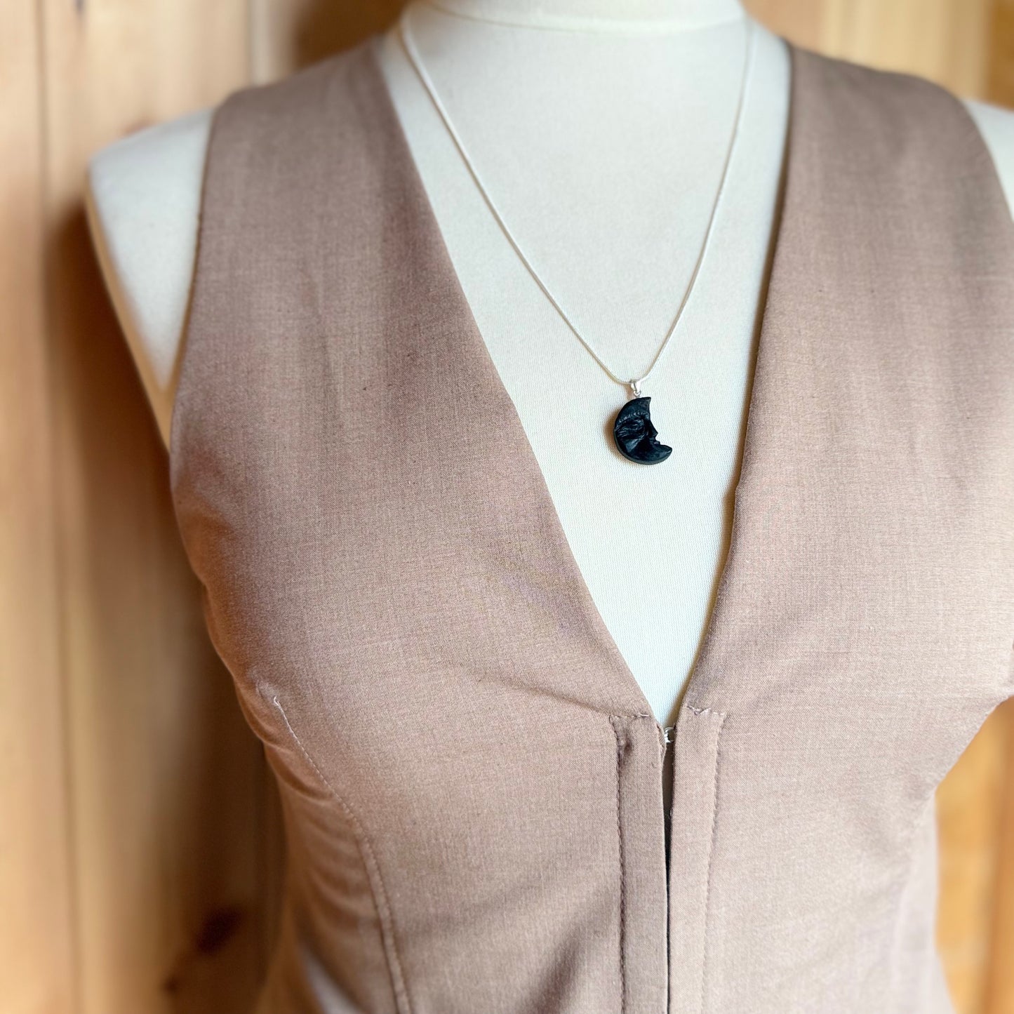 Side view of handmade black wood moon necklace – Celtic pagan gift