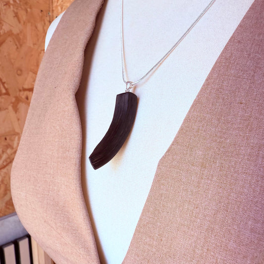 Handmade bog oak necklace on a silver-plated chain – unique dark wood jewelry with rustic elegance.