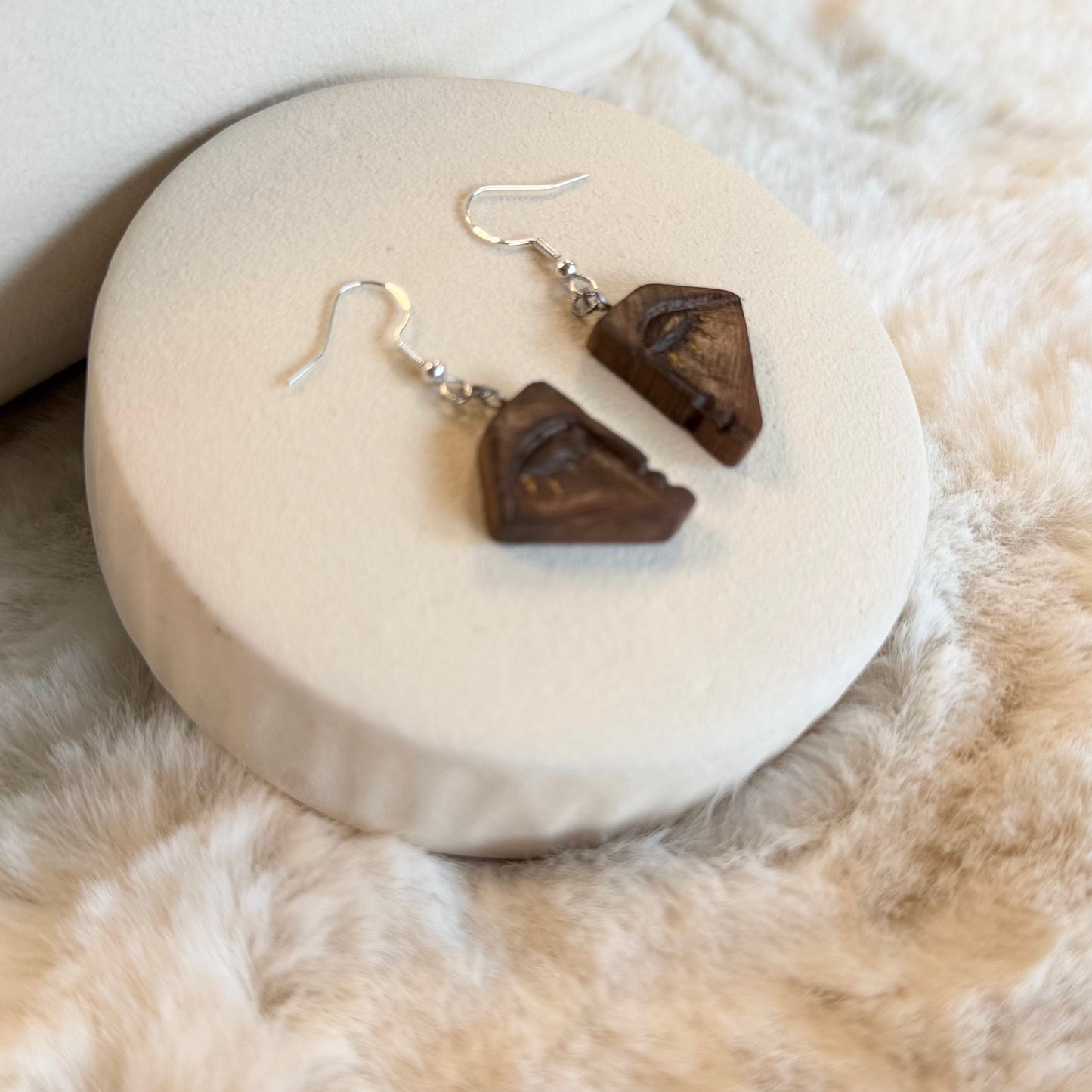 Sustainable wooden jewelry with abstract eye motif
