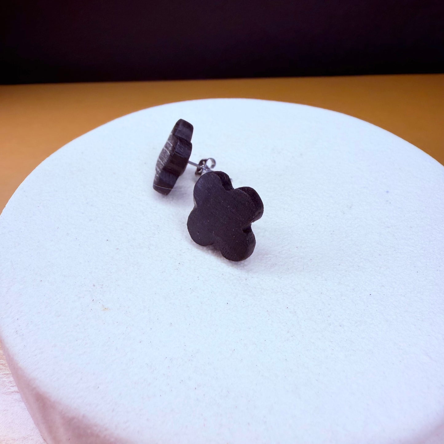 Elegant, eco-friendly handcrafted stud earrings made from ancient bog oak in a clover shape.