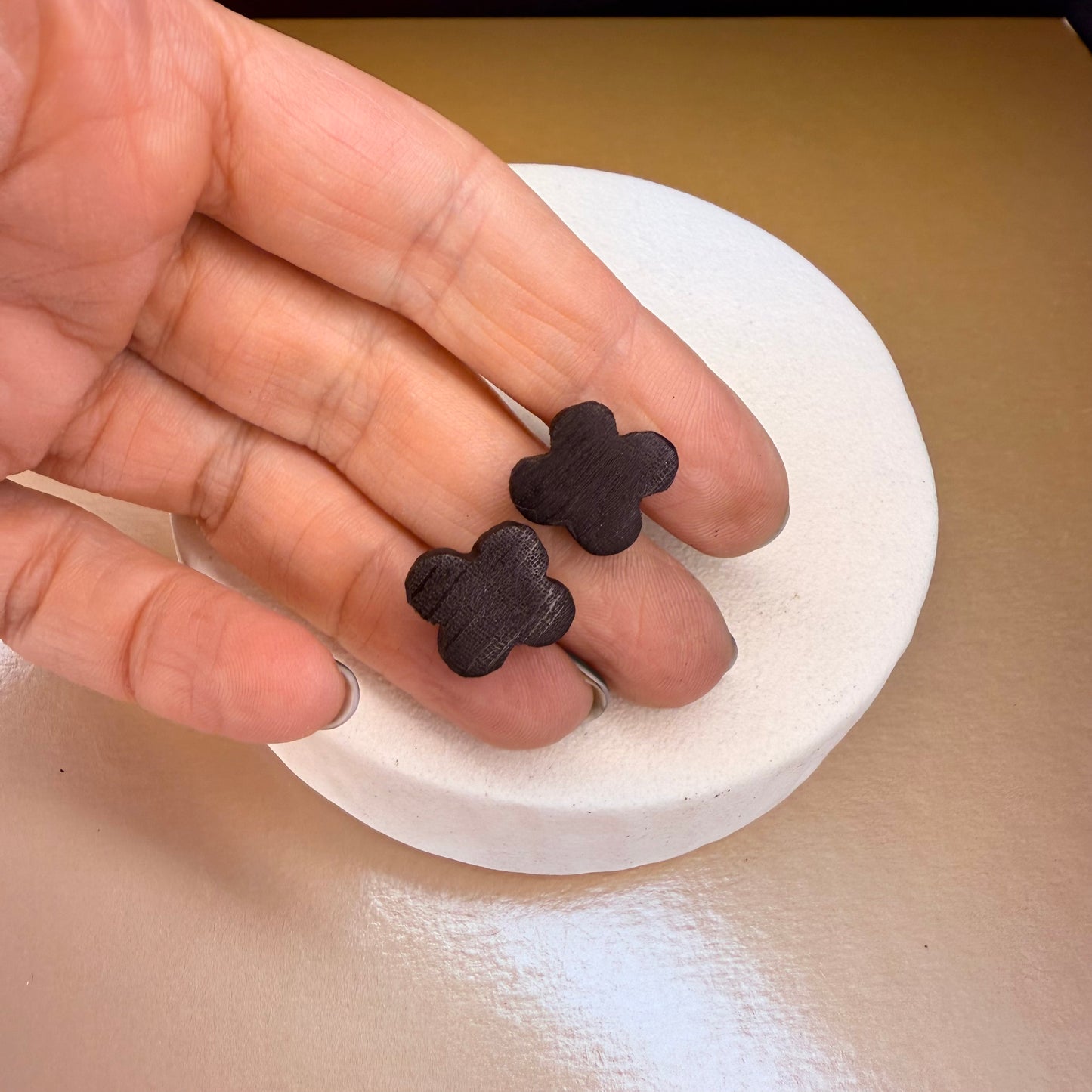 Ancient oak jewellery: Handcrafted stud earrings in clover shape, made from responsibly sourced bog oak.