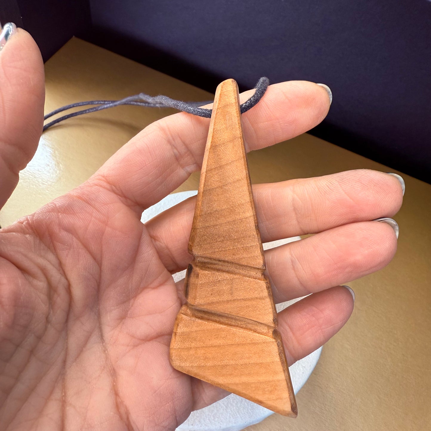 Adjustable waxed cord and wooden bead details of handmade apple wood necklace