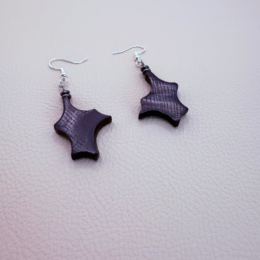Dangling Irish Bog Oak earrings with a dark gray hematite bead accent on a stainless steel hook.