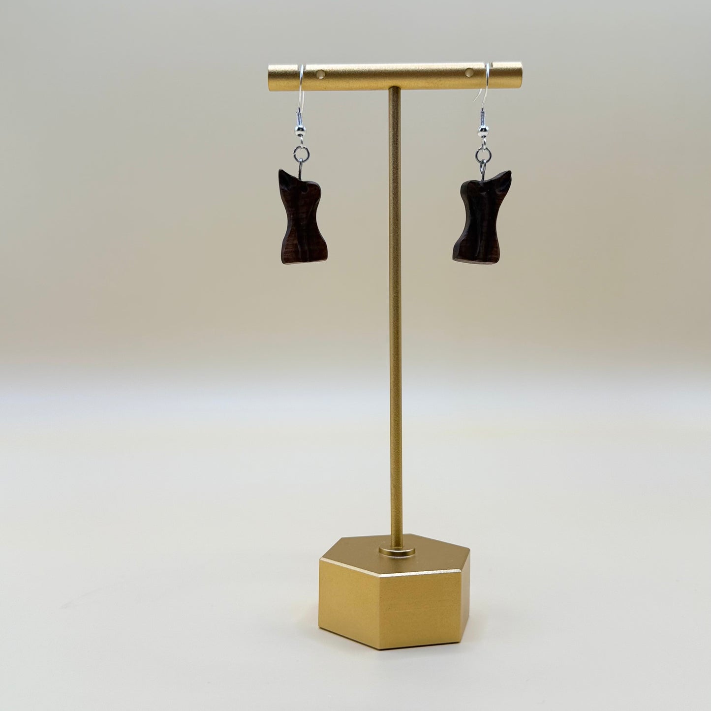 Polished bog pine earrings with organic texture