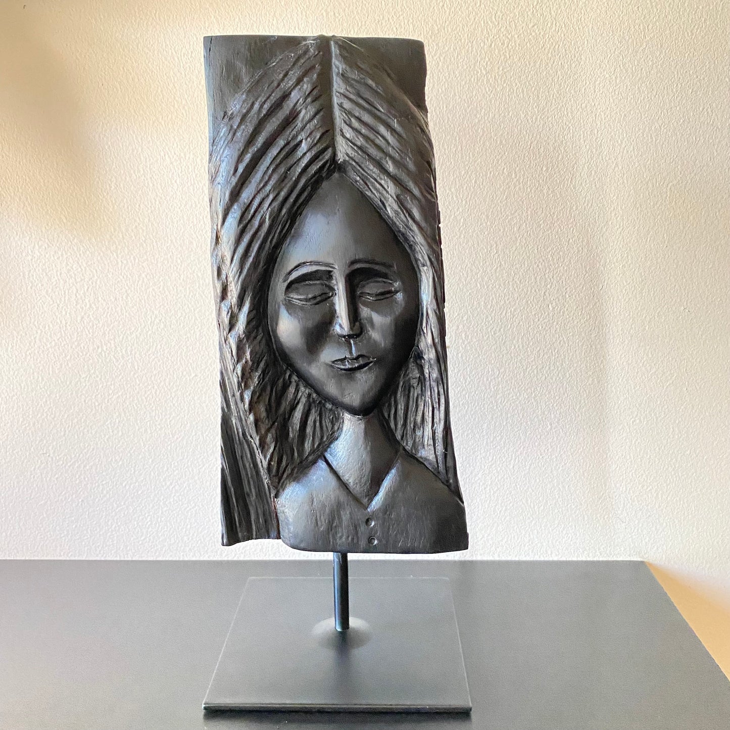 Irish Bog Oak Hand Carved Lady Sculpture on a Black Metal Stand.