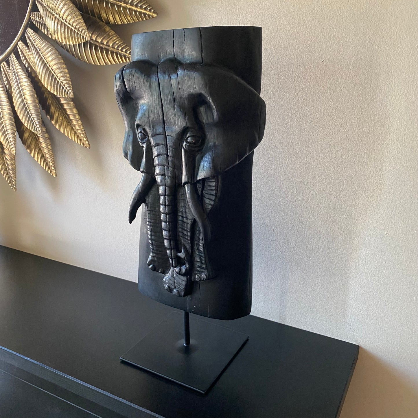 Irish Bog Oak Hand Carved Elephant Sculpture on a Black Metal Stand.