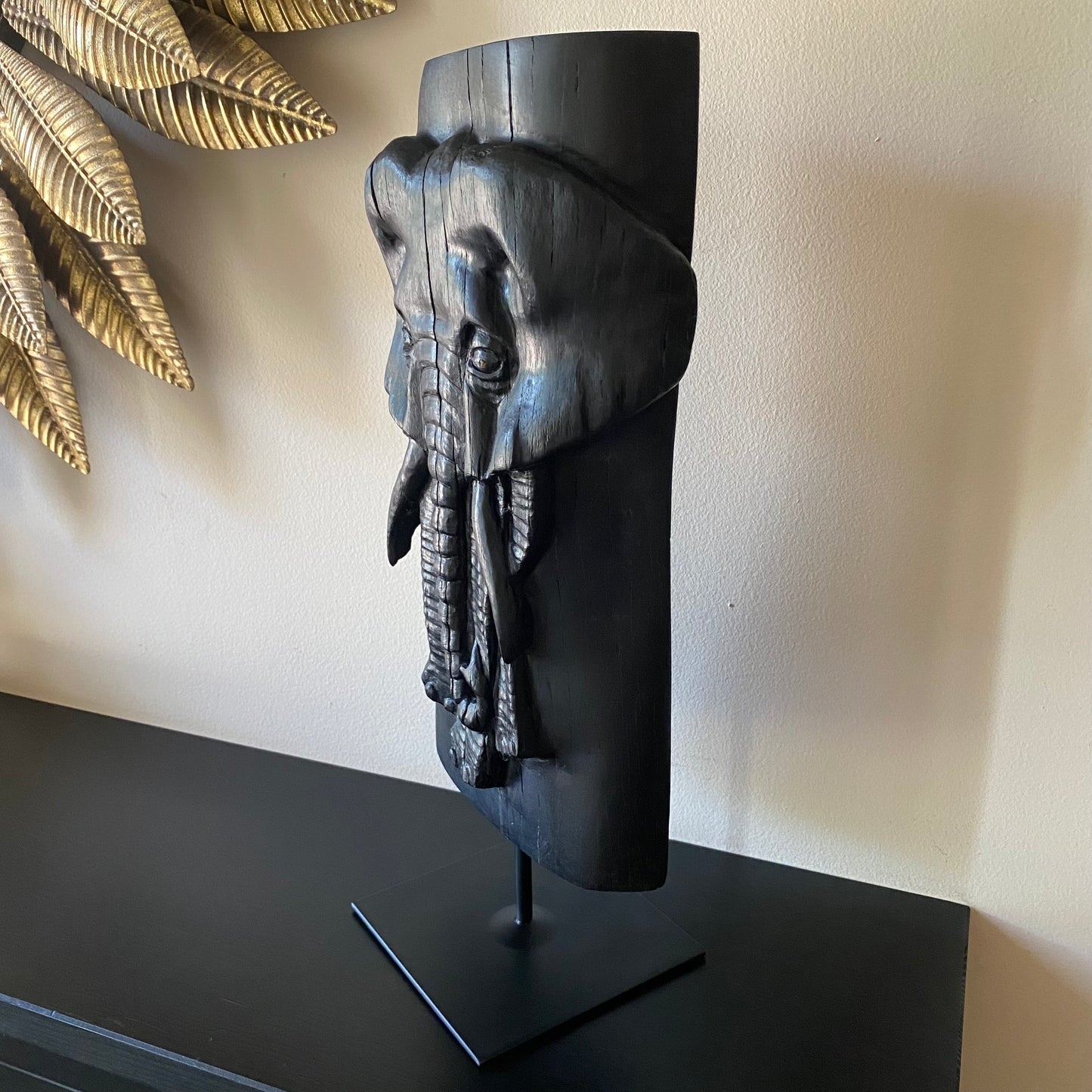 Irish Bog Oak Hand Carved Elephant Sculpture on a Black Metal Stand.