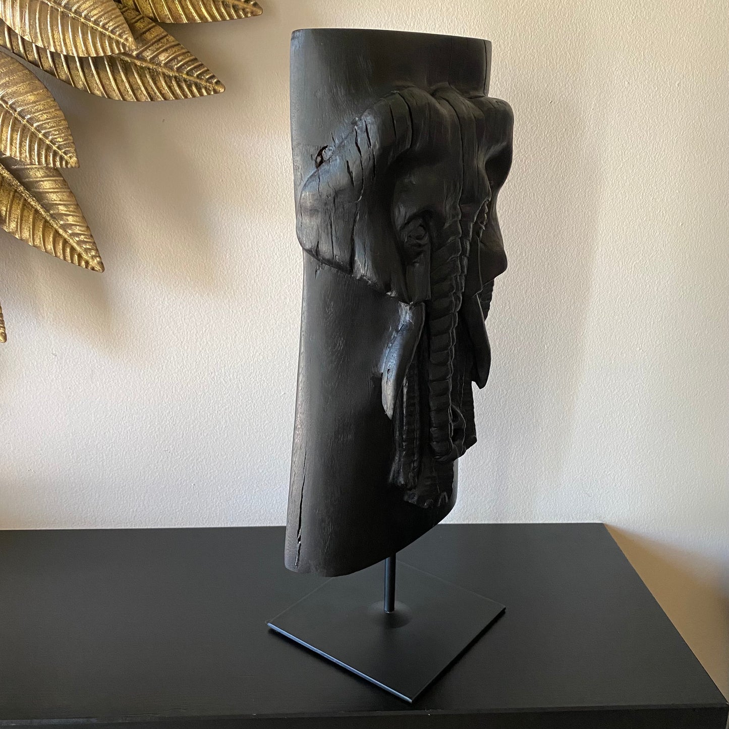 Irish Bog Oak Hand Carved Elephant Sculpture on a Black Metal Stand.