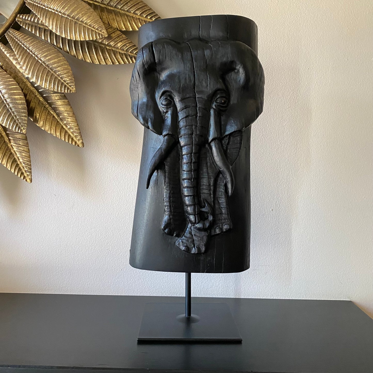 Irish Bog Oak Hand Carved Elephant Sculpture on a Black Metal Stand.