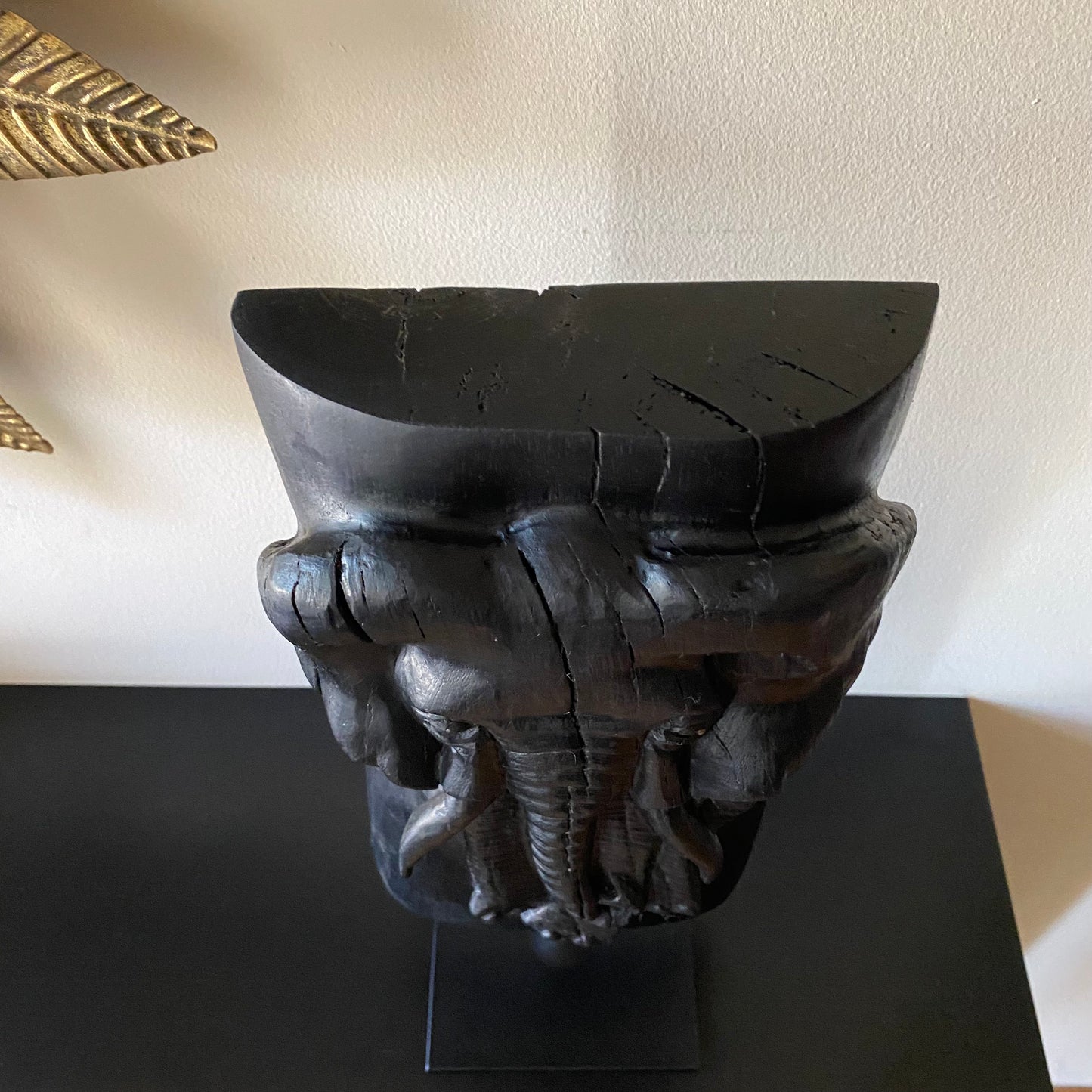 Irish Bog Oak Hand Carved Elephant Sculpture on a Black Metal Stand.