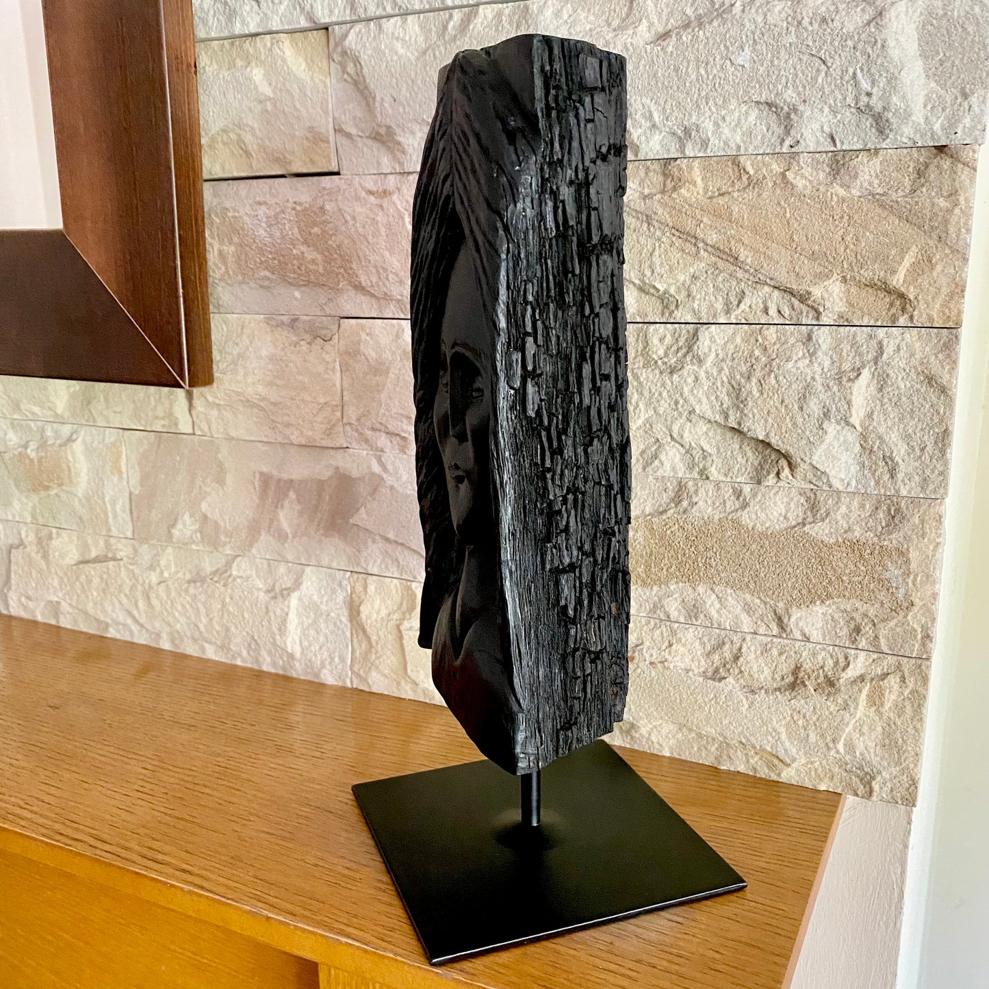 Irish Bog Oak Hand Carved Lady Sculpture on a Black Metal Stand.