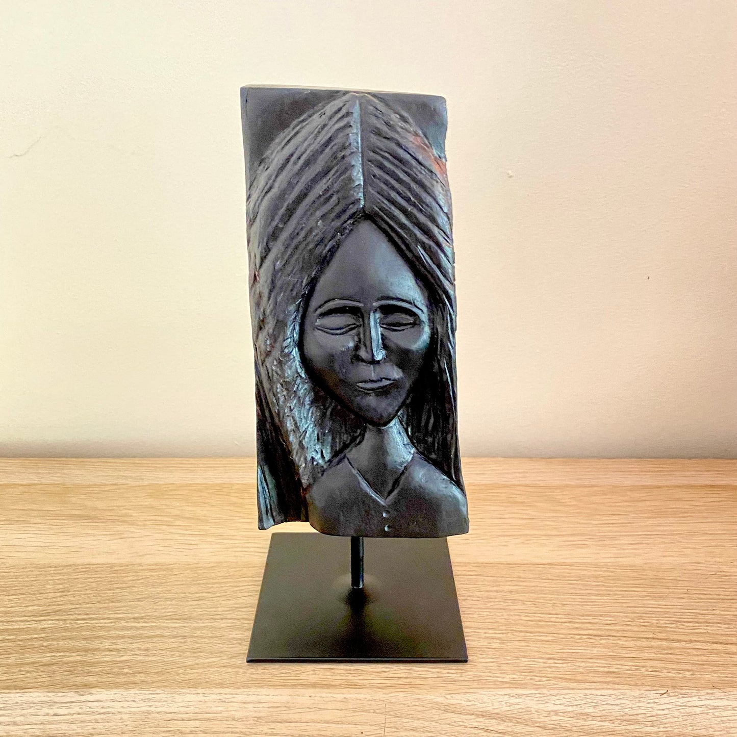 Irish Bog Oak Hand Carved Lady Sculpture on a Black Metal Stand.