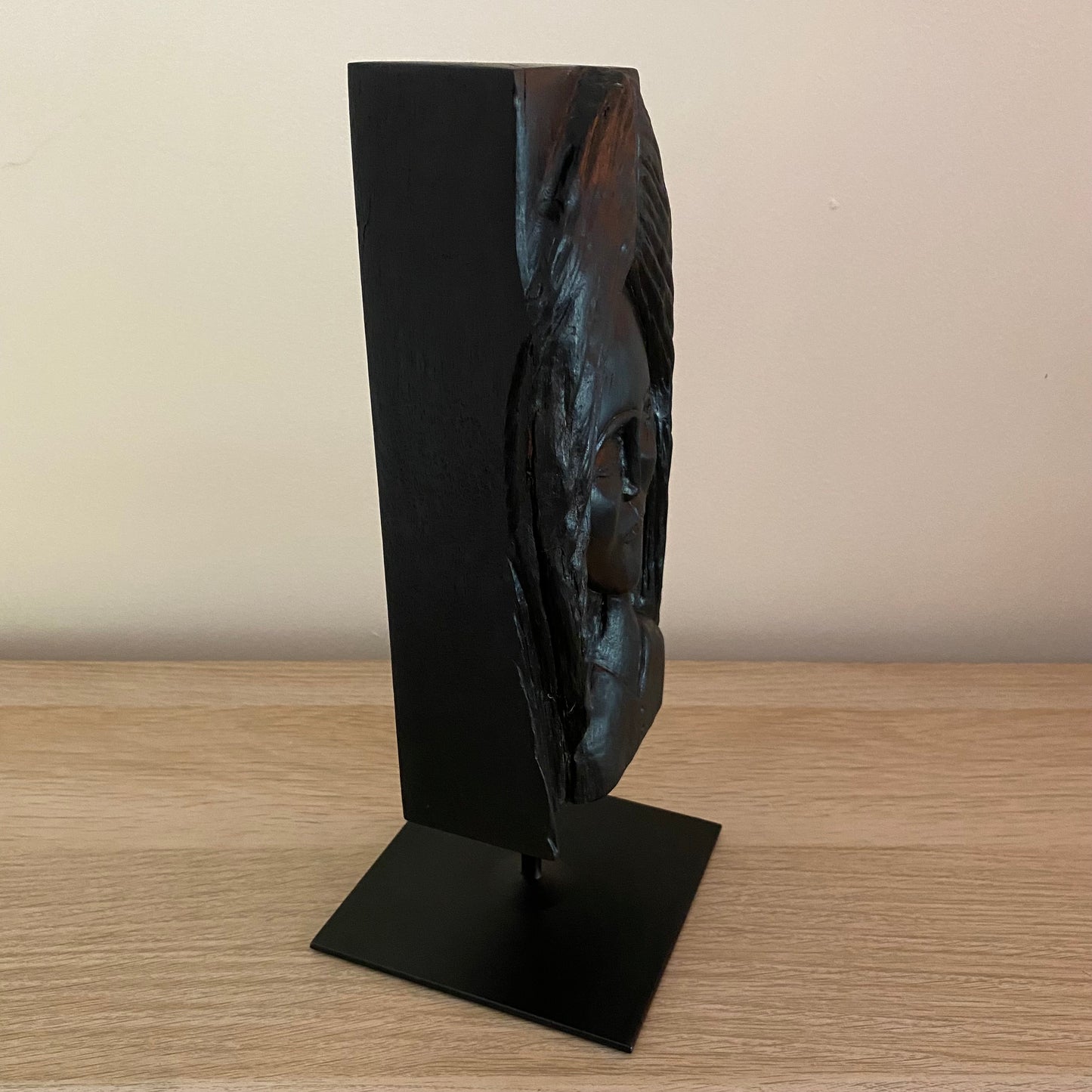 Irish Bog Oak Hand Carved Lady Sculpture on a Black Metal Stand.