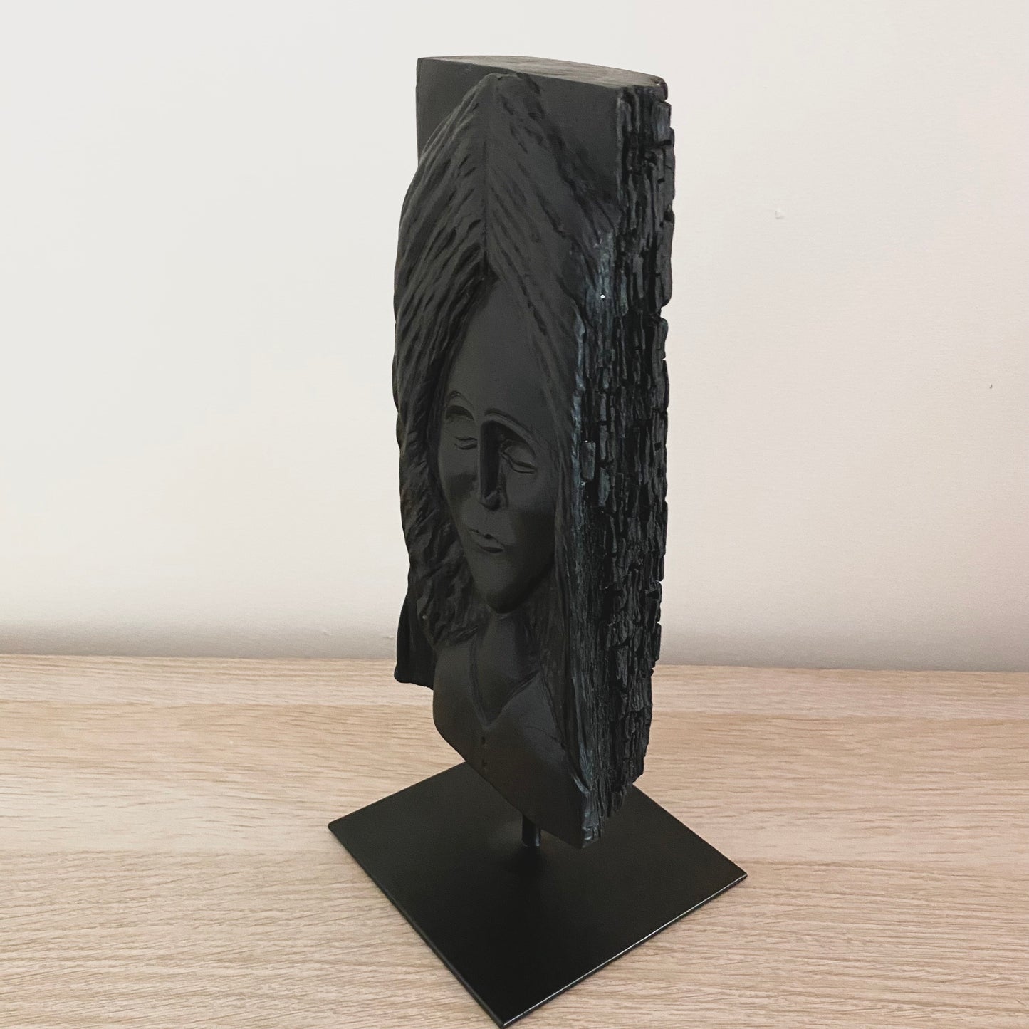 Irish Bog Oak Hand Carved Lady Sculpture on a Black Metal Stand.