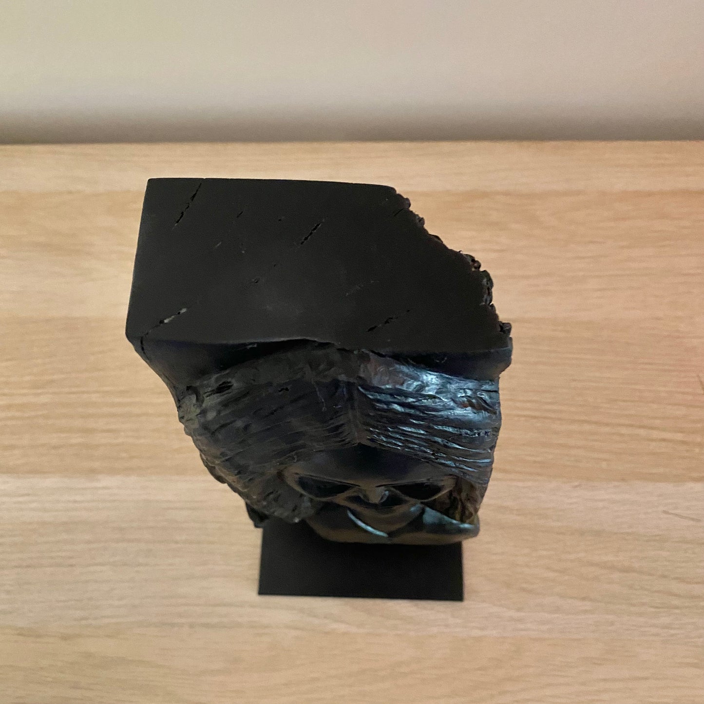 Irish Bog Oak Hand Carved Lady Sculpture on a Black Metal Stand.