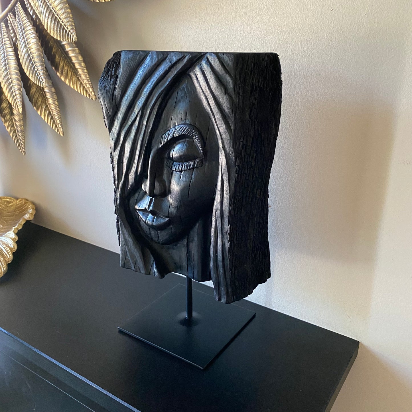 rish Bog Oak Hand Carved Woman Sculpture on a Black Metal Stand.