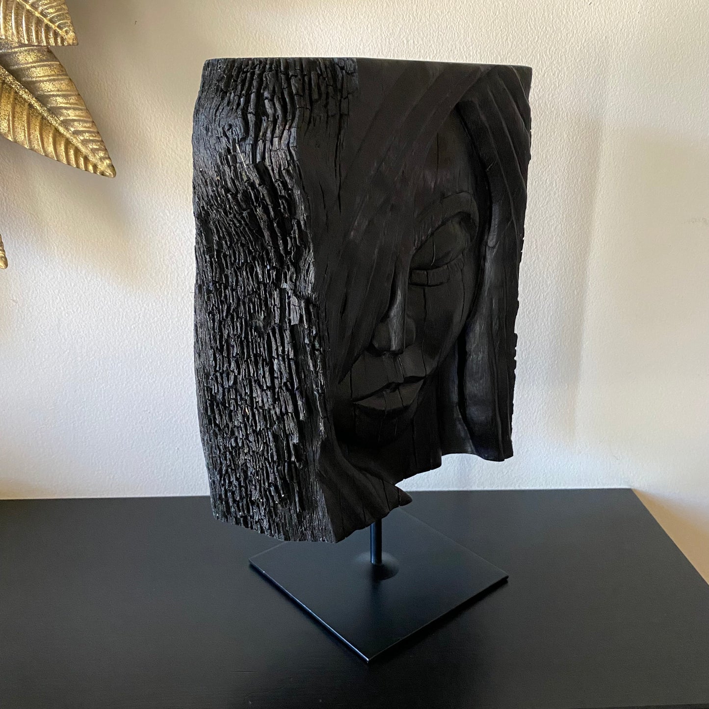 rish Bog Oak Hand Carved Woman Sculpture on a Black Metal Stand.