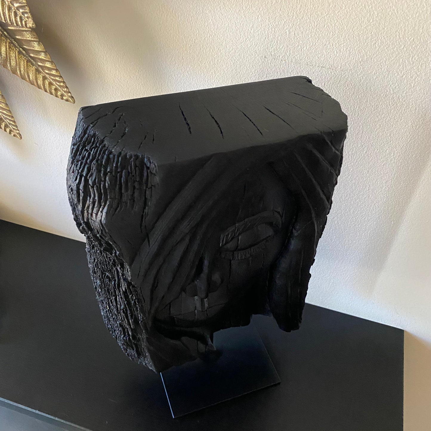 rish Bog Oak Hand Carved Woman Sculpture on a Black Metal Stand.
