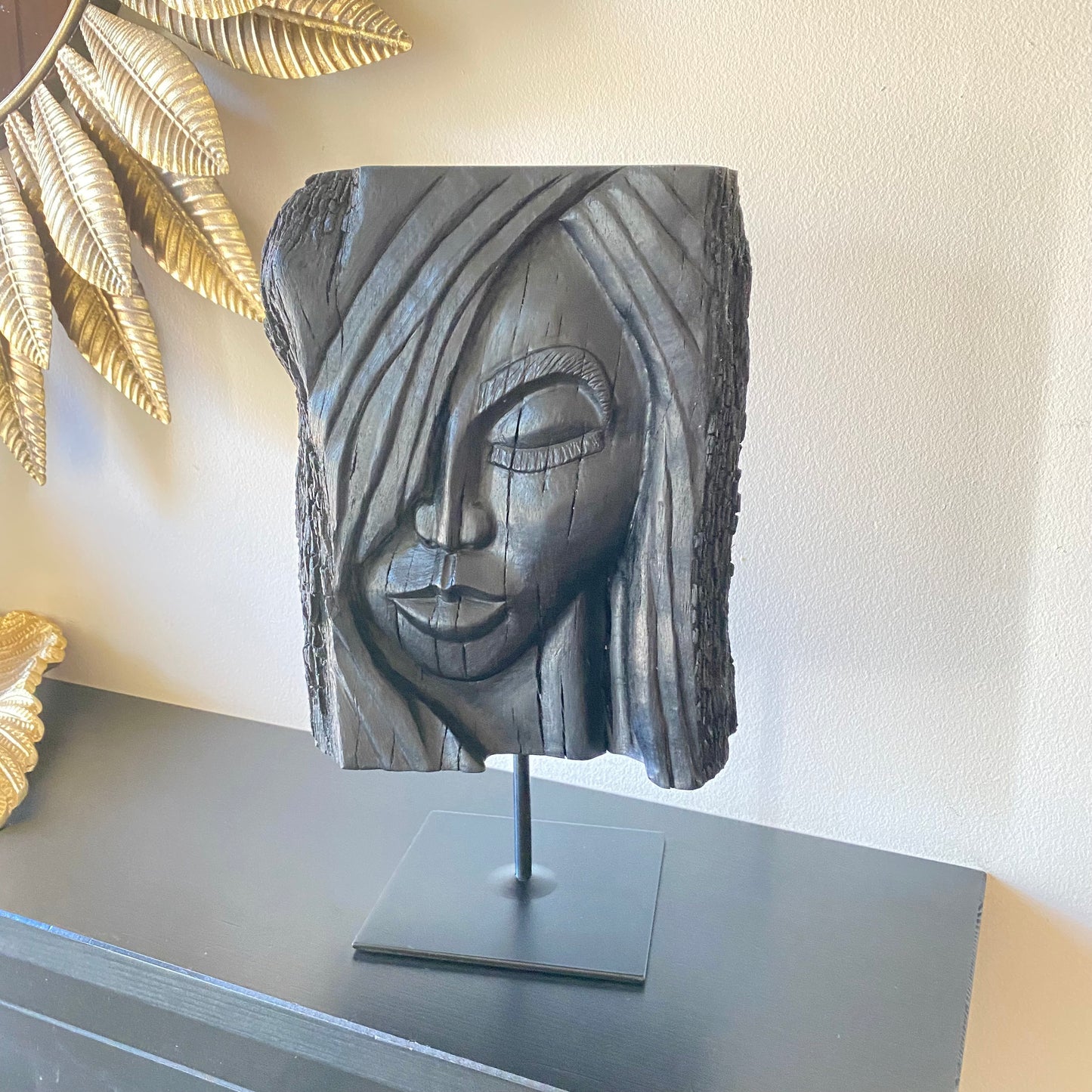 rish Bog Oak Hand Carved Woman Sculpture on a Black Metal Stand.