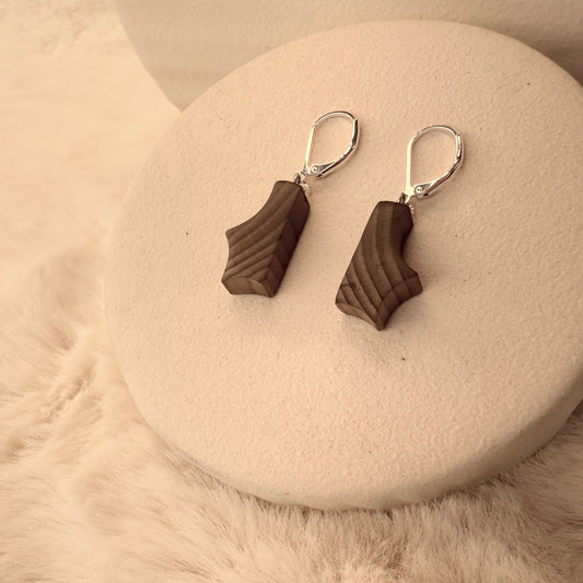 Handcrafted earrings made from ancient bog wood with 925 sterling silver hooks, featuring unique grain and natural wood tones