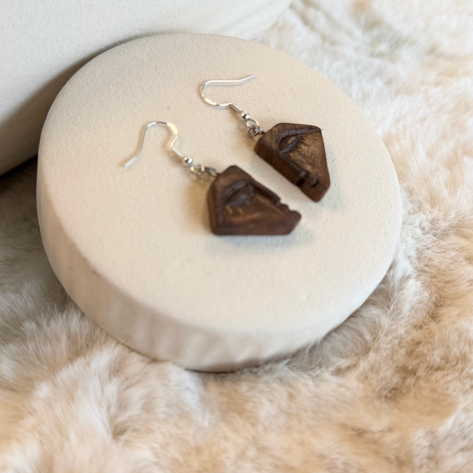Sustainable wooden jewelry with abstract eye motif