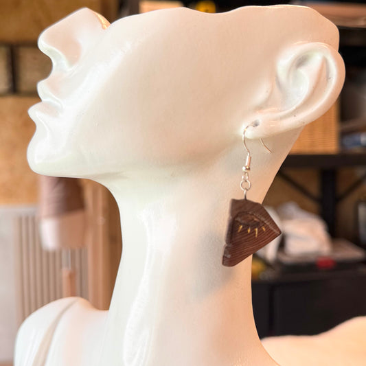 Hand-carved bog wood earrings with abstract eye design