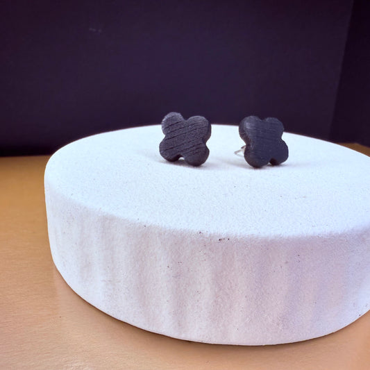 Handcrafted bog oak stud earrings in clover shape, featuring dark wood and ancient oak design