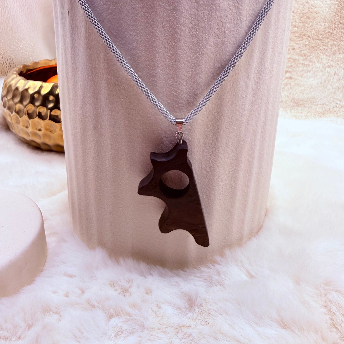 Minimalist artisan necklace crafted from bog oak and stainless steel.