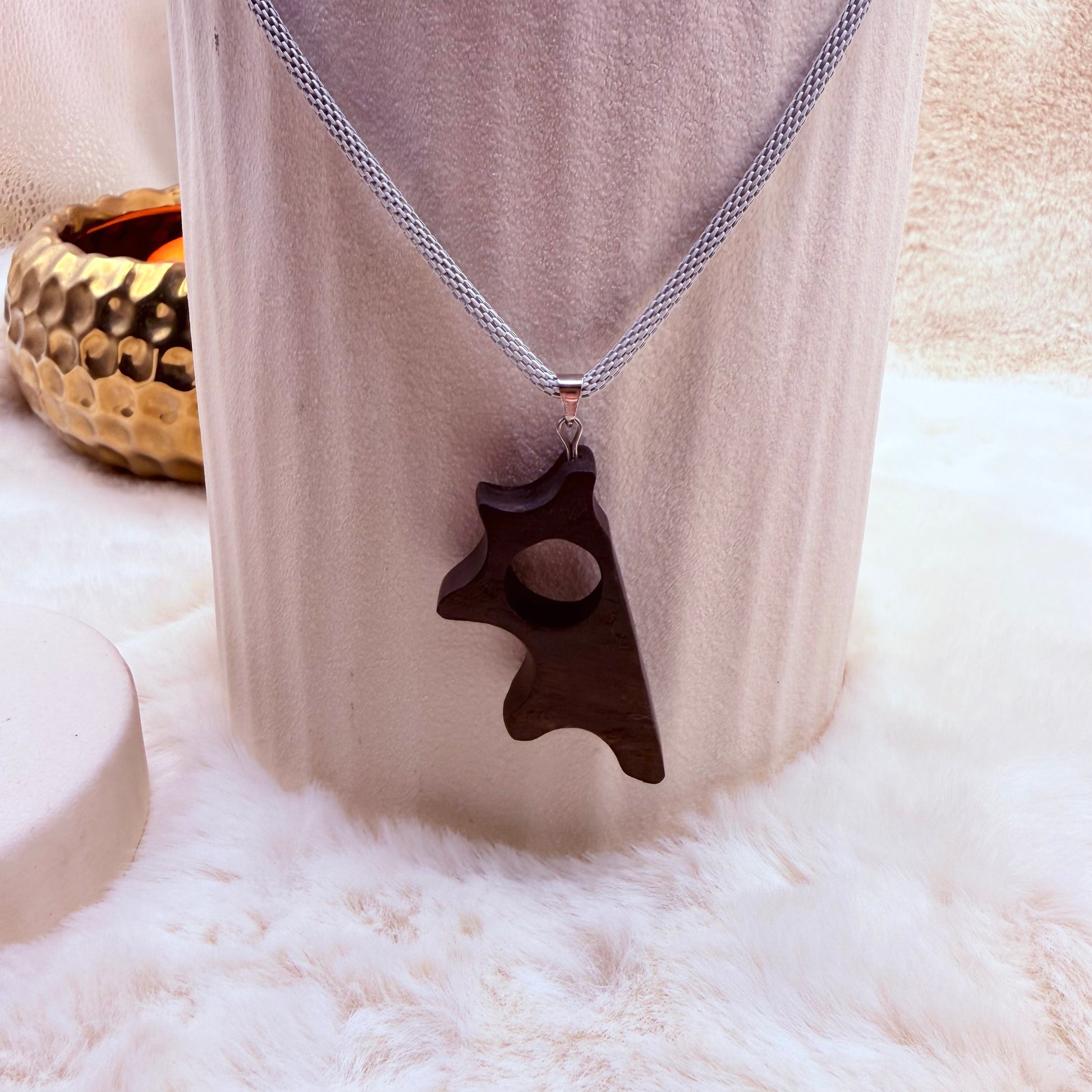 Minimalist artisan necklace crafted from bog oak and stainless steel.