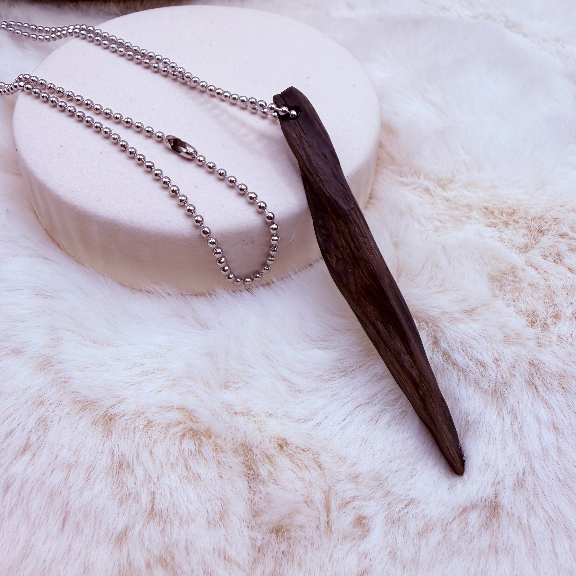 Handcrafted bog oak pendant necklace made from ancient wood. Natural, earthy, unique jewelry with meaningful character.