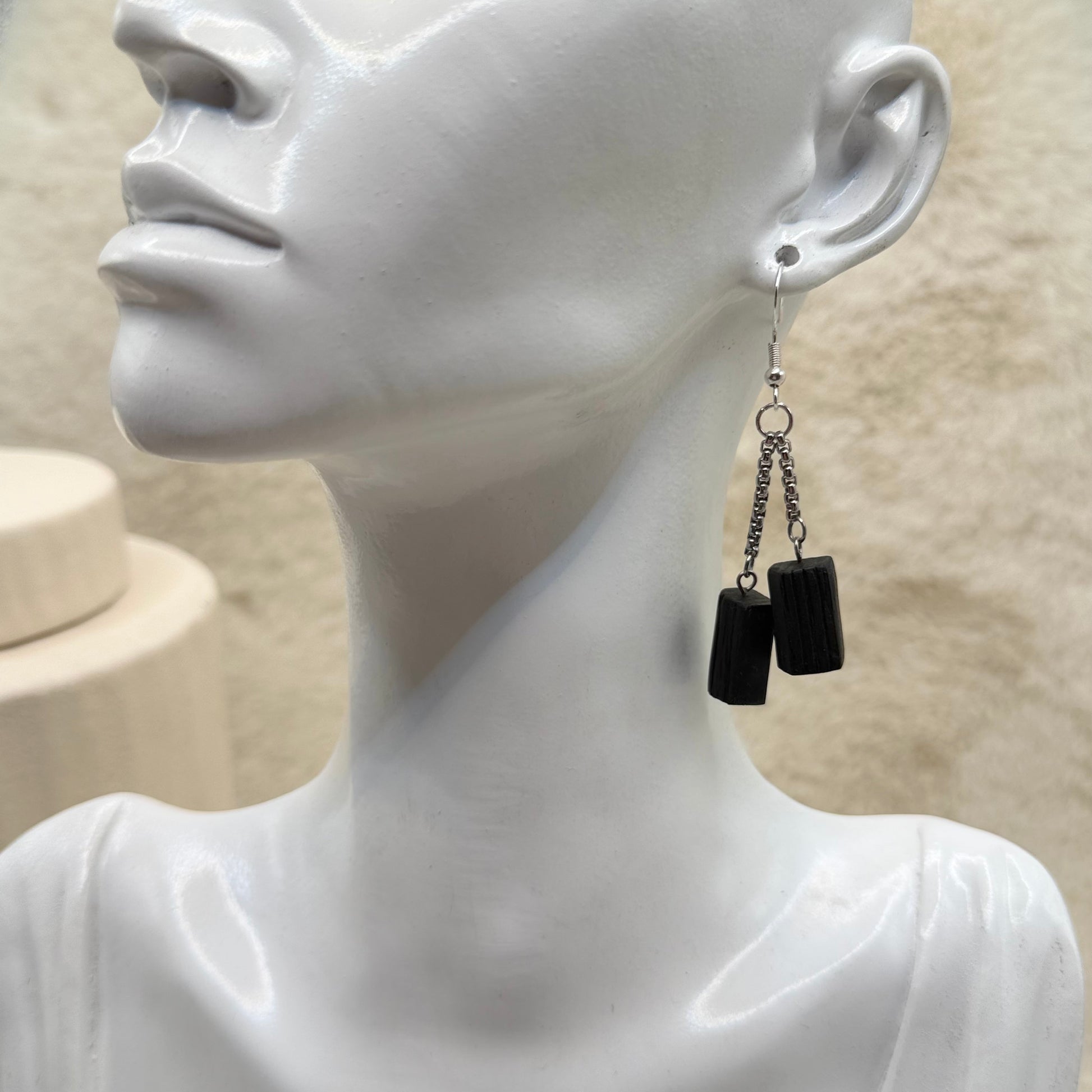 Minimalist bog oak wooden earrings – natural dark wood jewellery close-up