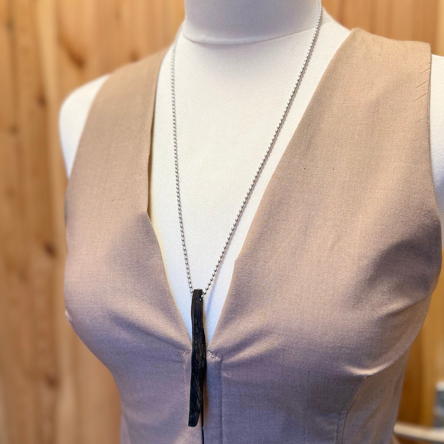 Unique bog oak necklace crafted from thousand-year-old wood. A refined, earthy accessory with deep character and history.